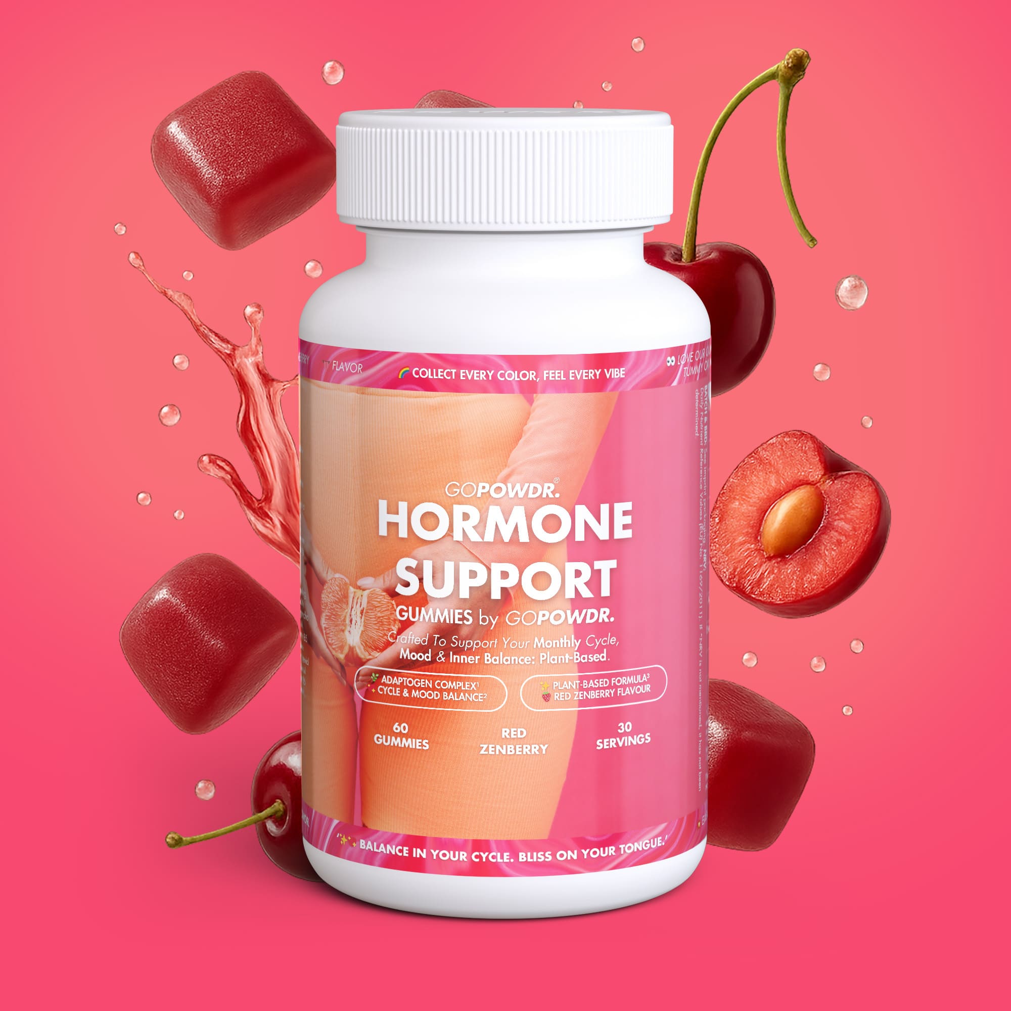 Bottle of hormone support gummies with cherry and berry elements on a pink background