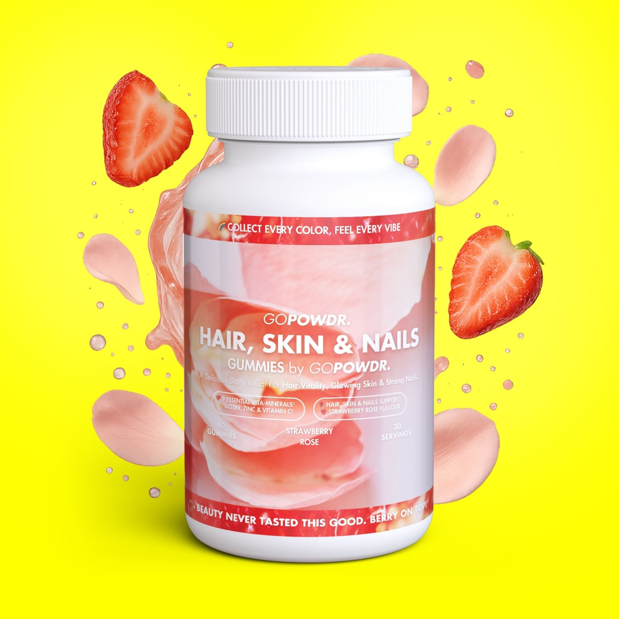 GOPOWDR Hair, Skin & Nails gummies bottle with strawberries and pink petals on a yellow background