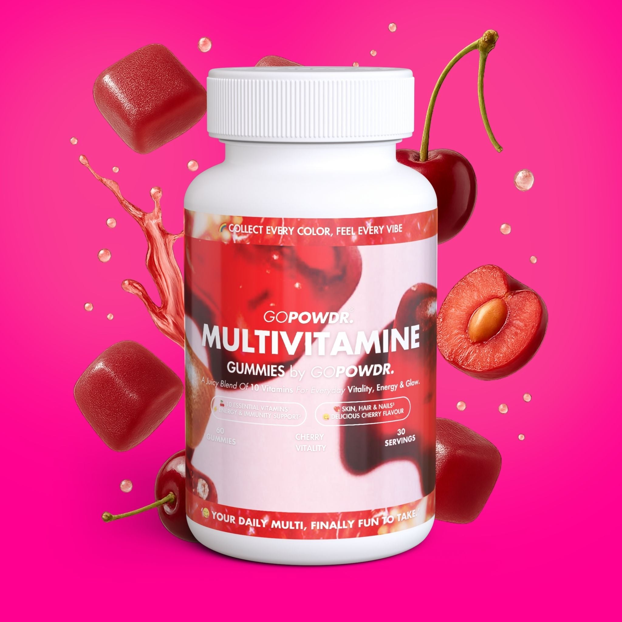 Multivitamin gummies bottle with cherry and red gummy elements on a pink background